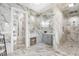 This elegant bathroom features a marble design, vanity area, standing shower and modern lighting fixtures at 4202 Links Ct, North Charleston, SC 29420
