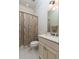 Cozy bathroom featuring a standard shower and vanity with white cabinets, offering a simple yet clean design at 4202 Links Ct, North Charleston, SC 29420