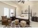 Traditional bedroom with a four-poster bed, neutral color palette, shutters, and cozy furniture at 4202 Links Ct, North Charleston, SC 29420