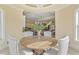 Bright dining area with wood table, seating, and a view of the kitchen, with a chandelier overhead at 4202 Links Ct, North Charleston, SC 29420