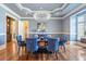 Sophisticated dining room with blue walls, tray ceiling, and modern chandelier at 4202 Links Ct, North Charleston, SC 29420