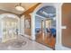 Elegant dining room with coffered ceiling, hardwood floors, and crystal chandelier at 4202 Links Ct, North Charleston, SC 29420