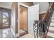 Interior shot of an elevator adjacent to an ornate stairway showcasing accessibility in this luxury home at 4202 Links Ct, North Charleston, SC 29420