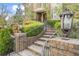 Inviting brick home entrance featuring elegant stairway and manicured landscaping at 4202 Links Ct, North Charleston, SC 29420