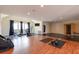 Spacious home gym area featuring dual flooring, workout equipment, and an installed sauna at 4202 Links Ct, North Charleston, SC 29420