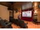 Home theater boasting comfortable seating, a large screen, a popcorn machine, and unique decorations at 4202 Links Ct, North Charleston, SC 29420