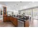 Spacious kitchen features wooden cabinets, granite countertops, stainless steel appliances, and plenty of natural light at 4202 Links Ct, North Charleston, SC 29420