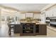Gourmet kitchen featuring custom cabinets, granite countertops, and stainless steel appliances at 4202 Links Ct, North Charleston, SC 29420