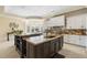 A spacious kitchen features an island with a sink and plenty of cabinet space at 4202 Links Ct, North Charleston, SC 29420