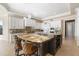 Gourmet kitchen featuring custom cabinets, granite countertops, stainless steel appliances, and a large island at 4202 Links Ct, North Charleston, SC 29420