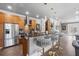Kitchen with stainless steel appliances, wood cabinets, granite countertops, and comfortable seating at the bar at 4202 Links Ct, North Charleston, SC 29420