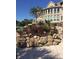Beautiful stone-terraced landscaping with colorful flowers and shrubs, providing a natural and inviting atmosphere at 4202 Links Ct, North Charleston, SC 29420