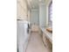 Laundry room with modern appliances, countertops, and custom cabinetry for ample storage at 4202 Links Ct, North Charleston, SC 29420