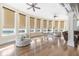 Open living room with hardwood floors, multiple windows, and neutral decor at 4202 Links Ct, North Charleston, SC 29420