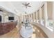 Bright living room with hardwood floors, large windows, comfortable sofas, and elegant architectural details at 4202 Links Ct, North Charleston, SC 29420