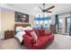 Spacious bedroom boasts a vibrant sitting area and a private balcony with lots of natural light at 4202 Links Ct, North Charleston, SC 29420