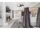 Luxurious main bedroom with fireplace, TV, ceiling fan and canopy bed at 4202 Links Ct, North Charleston, SC 29420