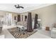 This is a stylish main bedroom features a zebra-print bed, brown curtains, and a modern ceiling fan at 4202 Links Ct, North Charleston, SC 29420