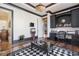 Cozy home office area featuring custom built-ins, dark trim, and hardwood flooring at 4202 Links Ct, North Charleston, SC 29420