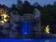 Enjoy a serene pool with a unique waterfall feature and ambient lighting for relaxation at 4202 Links Ct, North Charleston, SC 29420