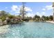 This beautiful inground pool features a rock waterfall at 4202 Links Ct, North Charleston, SC 29420