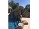 Backyard pool featuring a stunning rock waterfall, plants and trees at 4202 Links Ct, North Charleston, SC 29420