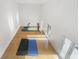 Bright racquetball court featuring exercise equipment and wood floors for active living at 4202 Links Ct, North Charleston, SC 29420