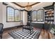 Elegant study with hardwood floors, built-in bookcases, and arched windows at 4202 Links Ct, North Charleston, SC 29420