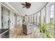 Bright sun room with hardwood floors, lots of natural light, and comfortable seating area perfect for relaxation at 4202 Links Ct, North Charleston, SC 29420