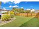 Well-maintained backyard with lush lawn, wooden fence, mature trees, and landscaping surrounding the perimeter of the yard at 422 Sanders Farm Ln, Charleston, SC 29492