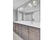 Bathroom featuring a double sink vanity, large mirror, and a shower with glass doors at 422 Sanders Farm Ln, Charleston, SC 29492