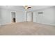 Open bedroom with neutral carpet, fresh paint, and several doorways and an attached bath at 422 Sanders Farm Ln, Charleston, SC 29492