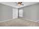 Bedroom featuring carpeted floors, closet, and a ceiling fan at 422 Sanders Farm Ln, Charleston, SC 29492