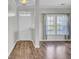 Entryway with hardwood flooring and a view of the living room with large windows at 422 Sanders Farm Ln, Charleston, SC 29492