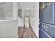Entryway with hardwood flooring, white walls, and stairs visible in the background at 422 Sanders Farm Ln, Charleston, SC 29492
