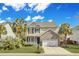 Charming two-story home with a combination of brick and siding and a well-manicured lawn at 422 Sanders Farm Ln, Charleston, SC 29492