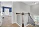 Hallway featuring carpeted floors and a wrought iron railing at 422 Sanders Farm Ln, Charleston, SC 29492