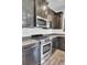 This kitchen features a stainless steel stove and oven, granite counters, and dark wood cabinets at 422 Sanders Farm Ln, Charleston, SC 29492