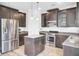 Modern kitchen boasts stainless steel appliances, dark wood cabinetry, and stylish island at 422 Sanders Farm Ln, Charleston, SC 29492