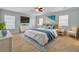 Serene main bedroom showcasing stylish furnishings, a ceiling fan, and ample natural light at 422 Sanders Farm Ln, Charleston, SC 29492