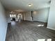 Open-concept living area with hardwood floors leading to the kitchen and stairs at 5124 Double Eagle, Summerville, SC 29485