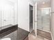 Bright bathroom featuring a glass shower, modern fixtures, and granite countertop with wood cabinets at 522 Truman Dr, Goose Creek, SC 29445