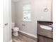 Bathroom featuring a modern vanity with a dark countertop, toilet, and a window at 522 Truman Dr, Goose Creek, SC 29445