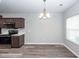 Dining area next to the kitchen, featuring modern pendant lighting and views of the backyard through a window at 522 Truman Dr, Goose Creek, SC 29445
