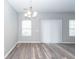 Dining room with grey walls, wood floors, and natural light at 522 Truman Dr, Goose Creek, SC 29445