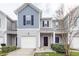 Charming townhome featuring a gray facade, well-maintained landscaping, and an attached one-car garage at 522 Truman Dr, Goose Creek, SC 29445