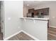 Modern kitchen featuring stainless steel appliances, dark cabinets, white countertops, and wood-look floors at 522 Truman Dr, Goose Creek, SC 29445