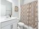 Bright bathroom featuring a white vanity, decorative shower curtain, and modern fixtures at 532 Fern Tree Dr, Summerville, SC 29486