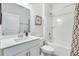 Well-lit bathroom featuring a modern vanity, stylish mirror, and a bathtub with a shower, offering a clean design at 532 Fern Tree Dr, Summerville, SC 29486