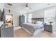 Bright bedroom featuring carpet floors, a ceiling fan, and two large windows for natural light at 532 Fern Tree Dr, Summerville, SC 29486